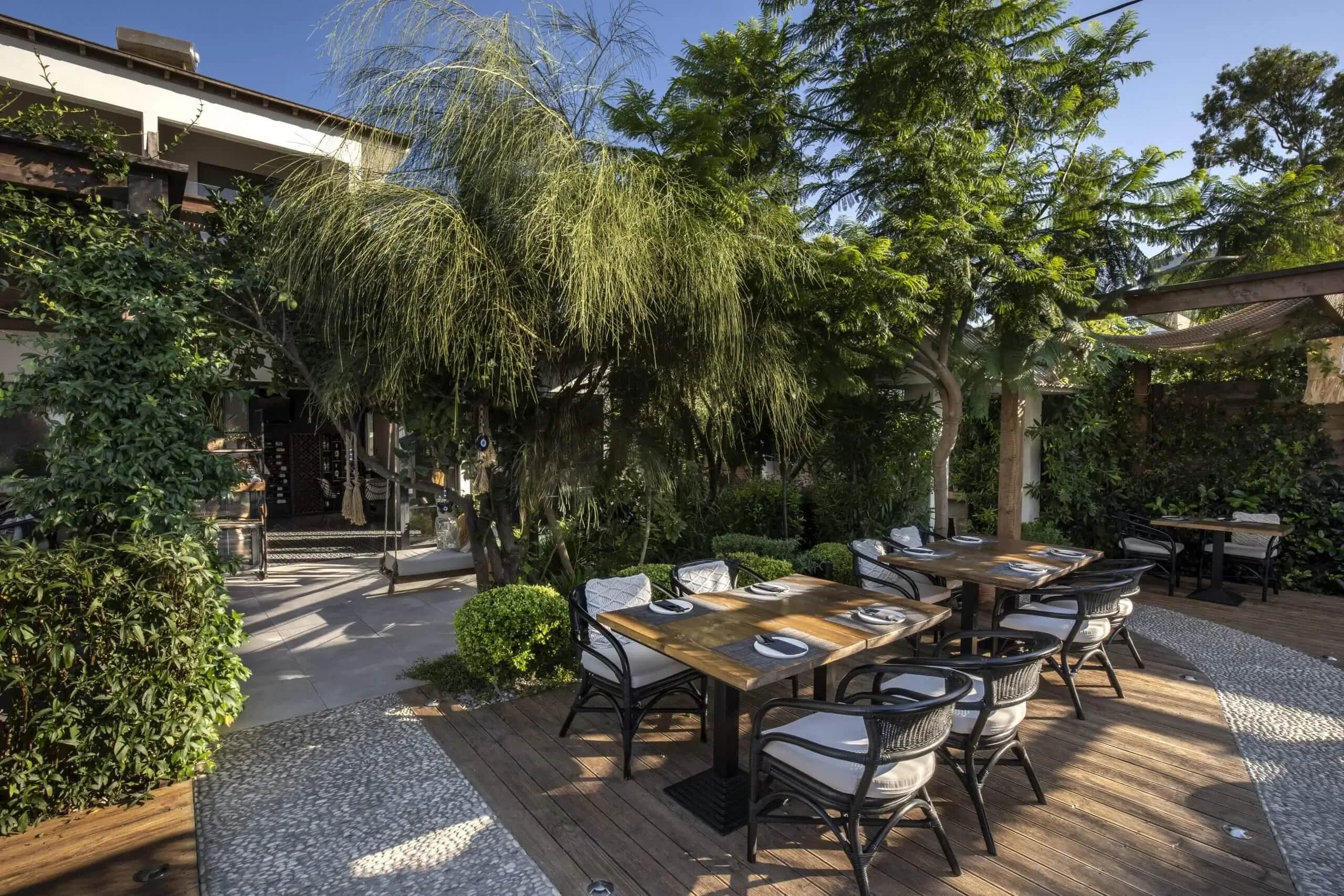 The planted beds running alongside the dining terrace